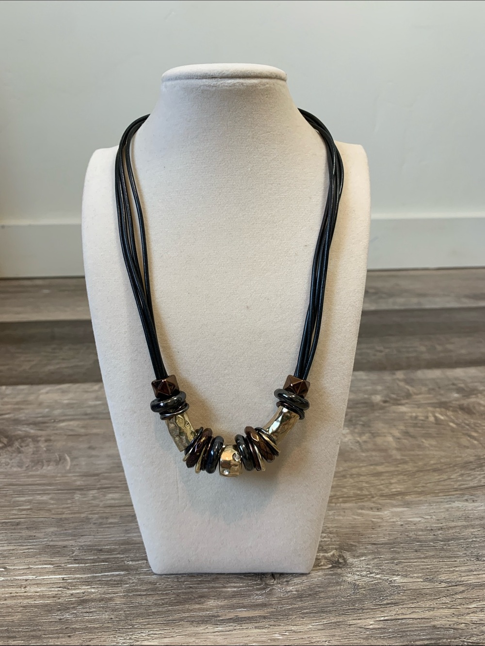 Multi-Strand Black Cord Necklace with Metallic and Brown Accents